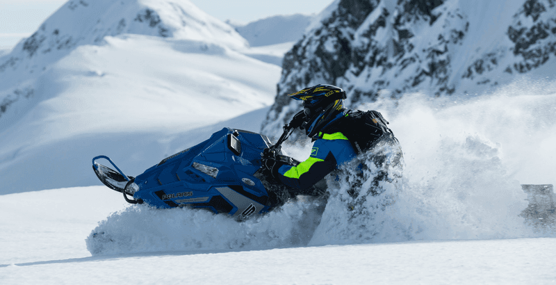 Snowmobile experience through alpine terrain